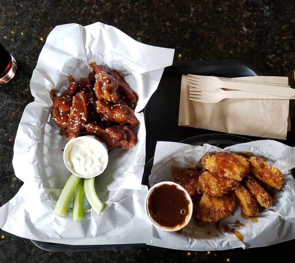 Glazed chicken wings in a dark pan