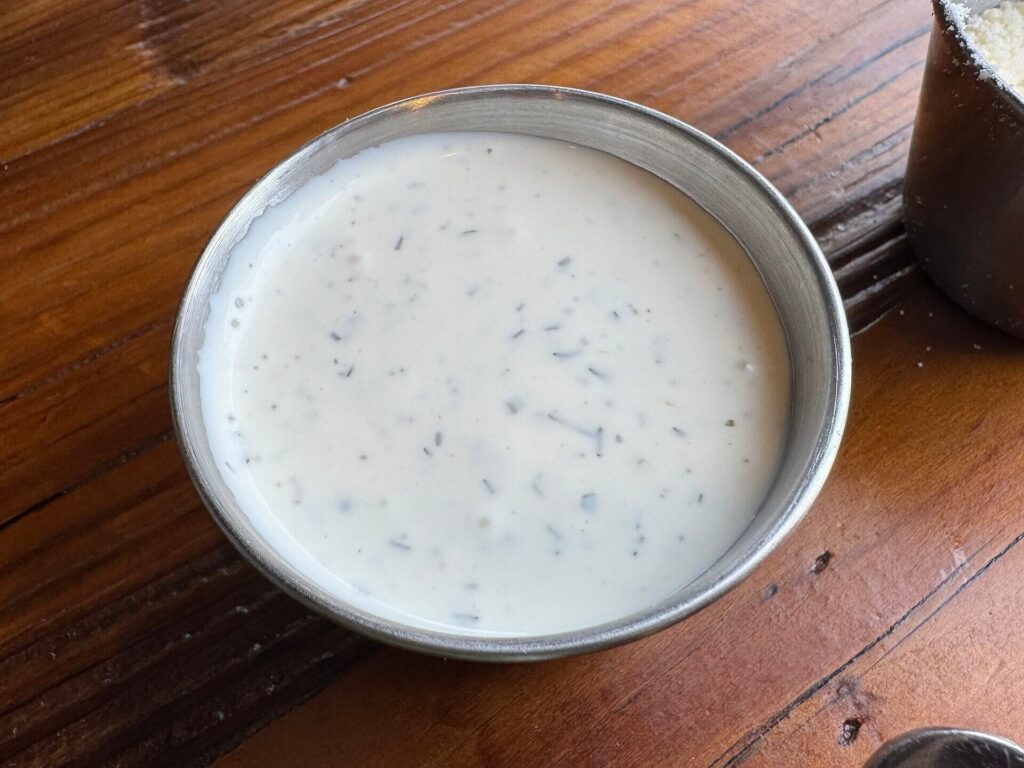 Herby ranch dip in a steel ramekin